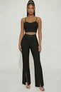Bustier crop top y pantalones de pierna ancha con abertura frontal